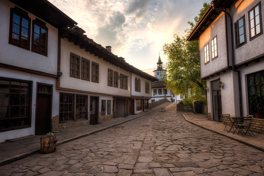First light above the old street / Morning view with an old street in the revival architectural complex in Tryavna, Bulgaria