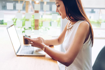 asian woman using mobile smartphone in cafe coffee shop