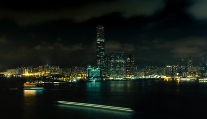 Fototapeta na wymiar A night view of the Kowloon waterfront at night with boat light trails - 2