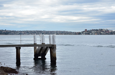 Old empty dock in cloudy day