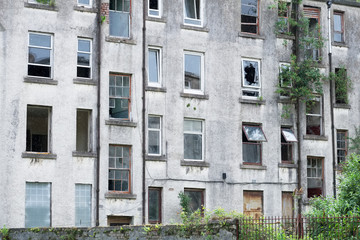 Poor council housing project now abandoned and derelict used by drug users as a squat