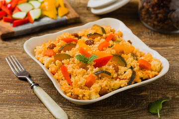 Millet with vegetables and raisins.
