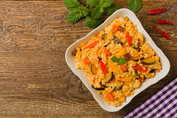 Millet with vegetables and raisins.