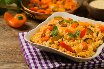 Millet with vegetables and raisins.