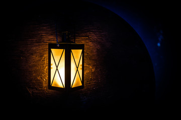 Arabic lantern with candle at night for Islamic holiday. Muslim holy month Ramadan. The end of Eid and Happy New Year.