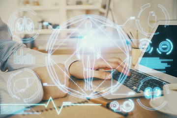 Science hologram with man working on computer on background. Concept of study. Double exposure.