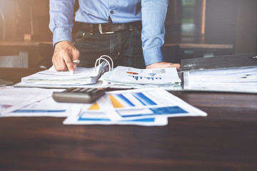 businessman planning strategy on desk with paperwork, Strategist team analyze data or information.