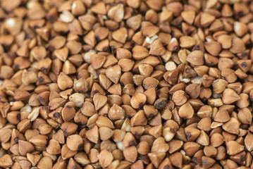 Buckwheat groats, macro photo, top. Dried seeds. Food photo, closeup.