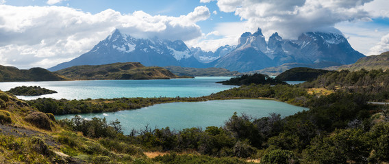 Torres del Paine National Park with snow capped mountains (Cordillera Paine) and the lake of Pehoe...