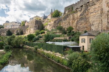 Fototapeta na wymiar Alzette river Luxembourg city downtown Grund with fortifications and gardens