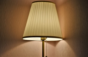 floor lamp with light in the dark at the corner of the room