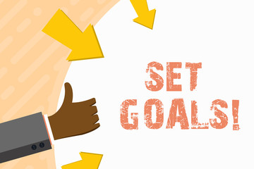 Word writing text Set Goals. Business photo showcasing process of identifying something that you want to accomplish Hand Gesturing Thumbs Up and Holding on Blank Space Round Shape with Arrows