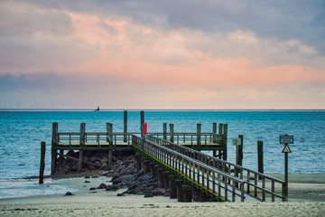 Obraz premium Pier at the beach of Wyk on the German Island of Foehr in cold November