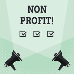 Conceptual hand writing showing Non Profit. Concept meaning not making or conducted primarily to make profit organization Spotlight Crisscrossing Upward from Megaphones on the Floor