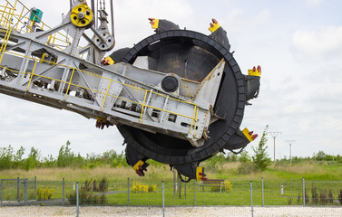 Opencast brown coal mine. Excavator SchRs-315. Extractive industry. © morissfoto