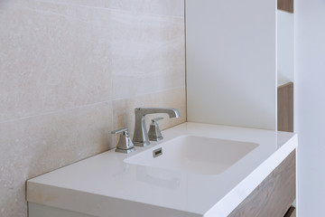 Bathroom interior with sink and faucet.
