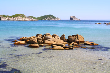 Beautiful landscape of a blue evening sea, horizon and rocks