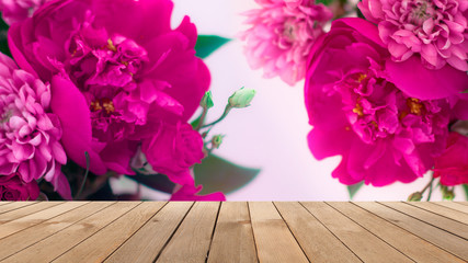 Delicate background of flowers peony. Blurred floral background. Wooden old table on the background of a blooming bouquet