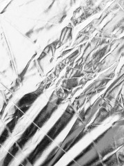 Fototapeta premium Crumpled silver material as abstract background