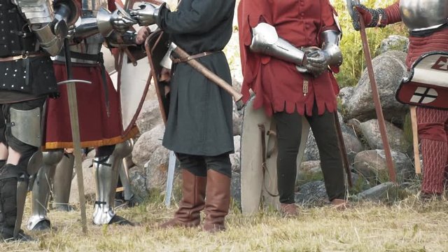 Medieval knights and warriors getting ready for battle