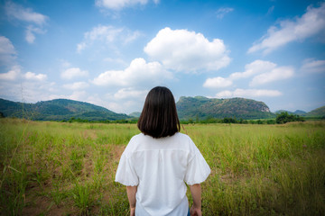 Young cute Asian Japanese girl hipster backpack women travelling looking at beautiful sky mountains scenery views 