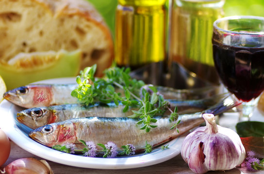 sardines and food ingredients, spices on table
