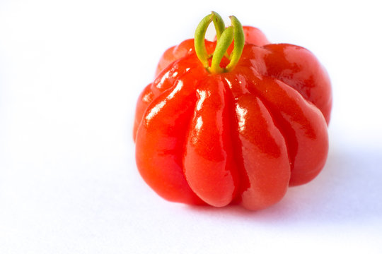 Pitanga fruit isolated on white. Brazilian cherry (Eugenia pitanga or Eugenia uniflora) is native to Brazil but today is a fruit cultivated in any tropical countries. 