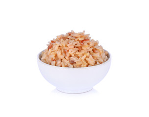 Rice brown in a bowl on white background