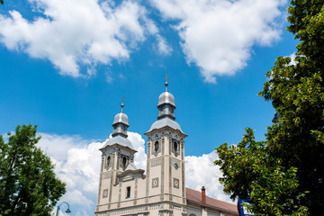 Fototapeta na wymiar Roman Catholic church , blue sky with white clouds.