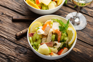 salad with seafood, potato and celery