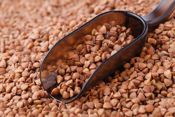 Scoop and buckwheat close-up