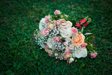 Gold wedding rings on the bouquet of flowers