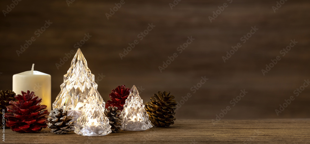 Poster modern glass christmas tree with lights on dark wood table with wall for merry chirstmas and new yea