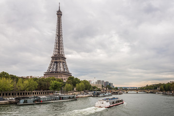 Fototapeta na wymiar Cloudy evening summer at the Eiffel Tower - Paris, France