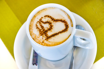 Cup of coffee with two hearts. It s symbol of Love in foam.