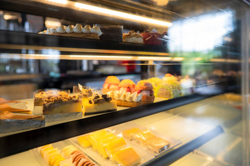 blurred cake carbinet use as coffee shop background style 