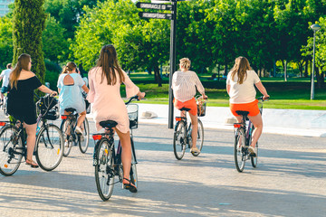 Tourist girls on the bicycles. Holidays in Spain.