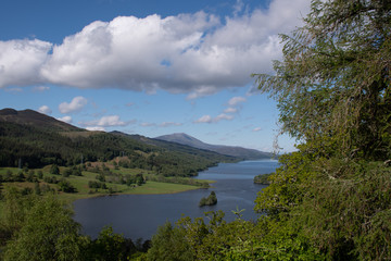 Caption	View over scottish loch with mountains	
