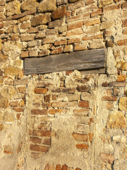 Typical detail of an ancient Italian house wall, made of hand-carved river stones.