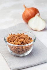 Fried onion in glass, topping for hot dog, fast food, vertical
