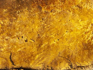 Typical detail of an ancient wall of an Italian house in Rimini, on the Adriatic coast, made of hand-carved stones.