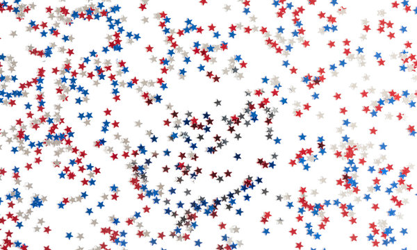 4th of July American Independence Day. Red, blue and white star confetti decorations on white background. Flat lay, top view, copy space