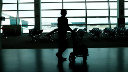silhouette shadow in airport man woman walking shadow