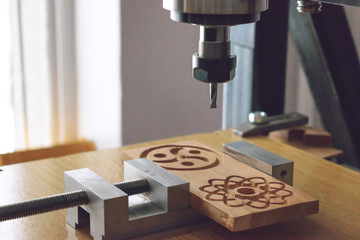 wood cutting machine 3D wood cnc router. CNC milling machine carving a wooden part blank. Cutter...