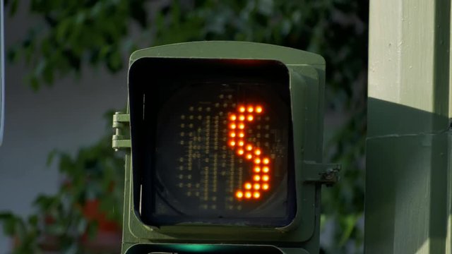 A Traffic Light Countdown From Ten To Red Man Figure