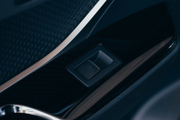 Front and back electric windows buttons-lower or close car windows. Leather upholstery, chrome ornaments.