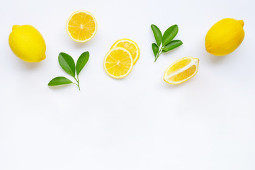 lemon and slices with leaves isolated on white.