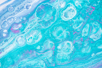 Beautiful background of liquid acrylic in blue, green and white on canvas