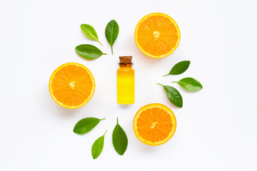 Essential oil with fresh orange citrus fruit  on white