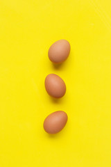 Eggs on yellow background.